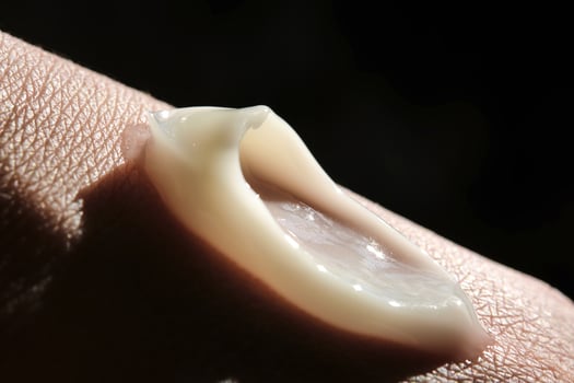 A smear of moisturizer on the hand. photo