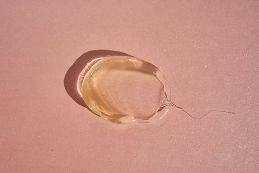 The texture of a yellow transparent gel cosmetic. photo