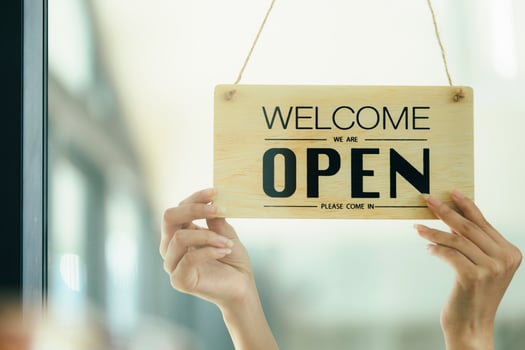 Close up Young business owner open the coffee shop. photo