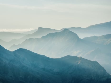 Silhouette of the mountains. Foggy layered mountain landscape. photo