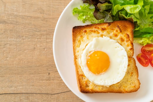 bread toasted with cheese and fried egg photo