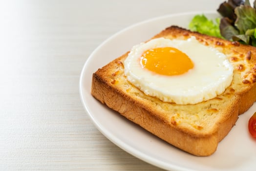 bread toasted with cheese and fried egg photo
