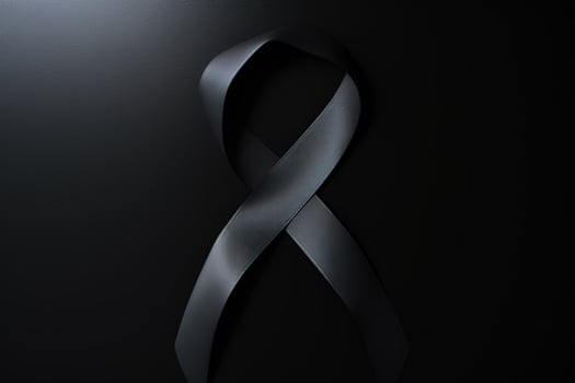 Black mourning ribbon with a dark background. photo