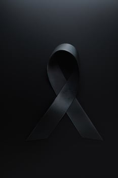 Black mourning ribbon with a dark background. photo