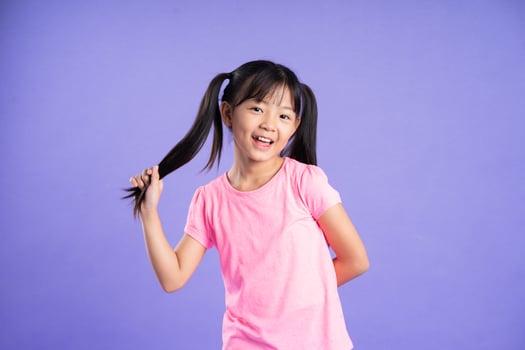 beautiful asian girl portrait posing on purple background photo