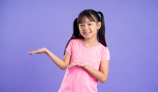 beautiful asian girl portrait posing on purple background photo