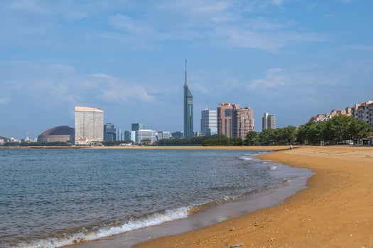 skyline of Fukuoka with Fukuoka tower by the beach in Kyushu, Japan photo