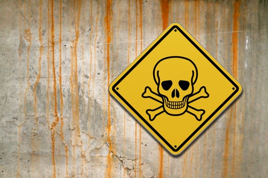 Toxic sign on a concrete wall photo