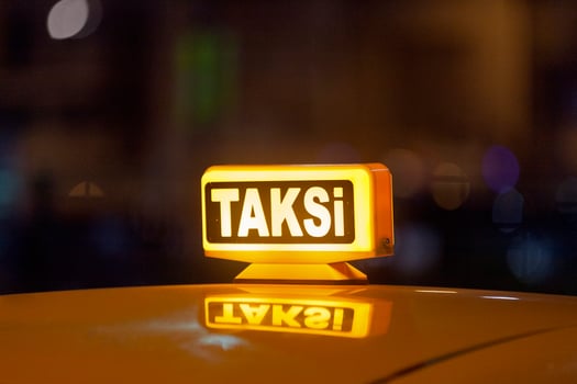 Illuminated yellow Turkish taxi sign photo