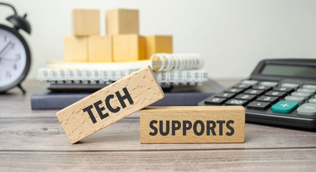 tech supports is shown on a conceptual photo using wooden blocks