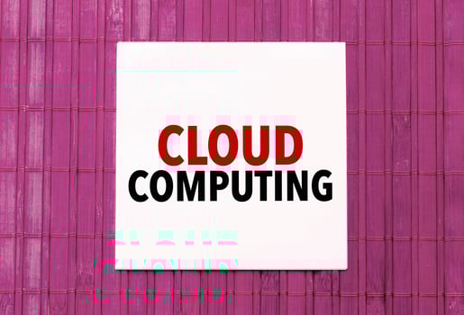 blank note pad with text cloud computing on blue wooden background photo