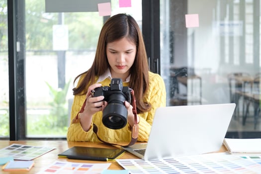 Young Asian Graphic Designer Working on Computer. photo