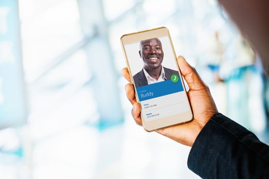 blank smartphone screen. dark skin hand holding a phone photo