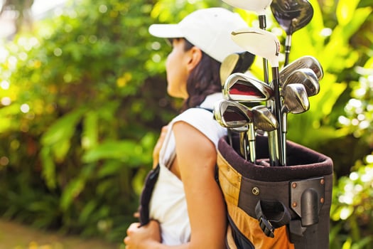 Beautiful young woman as a golf player photo