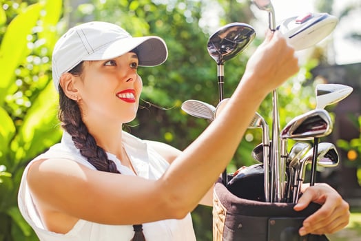 Woman with golf equipment photo