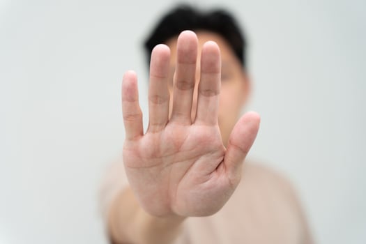 hand showing stop, insult. Pressure, sexism. Racism, stop violence expression with negative, stop taboo sign, rejecting, declining something, campaign against violence against women and children. photo