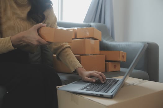 Business woman start up small business entrepreneur SME success .freelance woman working at home with Online Parcel delivery. SME and packaging deliveryconcept photo
