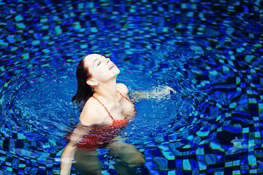 Beautiful woman on the swimming pool photo