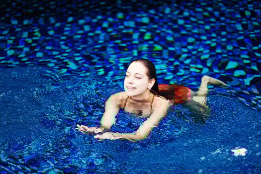 Beautiful woman on the swimming pool photo