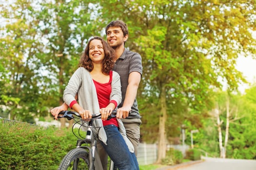 people in love - riding together on the same bicycle photo
