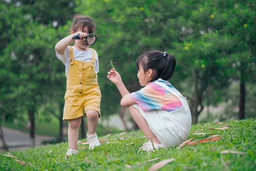 Photo of young Asian baby girl playing at park