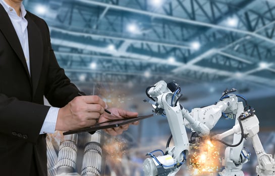 human control Robotic arm industry in parts manufacturing plants photo