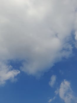 The white clouds on the blue sky are perfect for the background.  Skyscape on Lombok Island, Indonesia photo