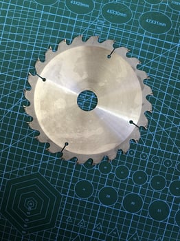 steel circular saw blade on the table photo