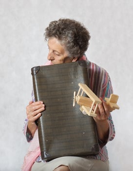 Old woman and old suitcase photo
