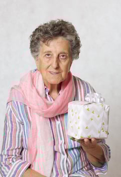 Old woman and a present photo