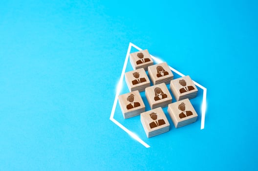 People are shaped into an arrowhead. Organizing into an effective team. Combining into an organized group. Cooperation and teamwork. Consolidation, strengthening. Common interest, problem solving. photo