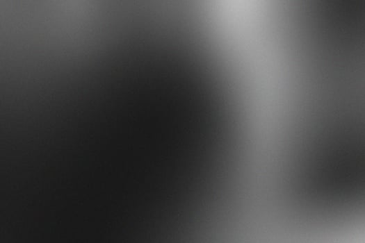 Abstract Black and Grey Blurry Background with Grainy Textures photo