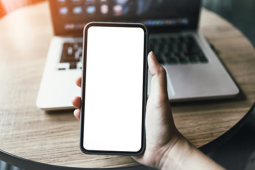 Women's hands holding cell telephone blank copy space screen. smartphone with blank white screen isolated on white background . smart phone with technology concept photo