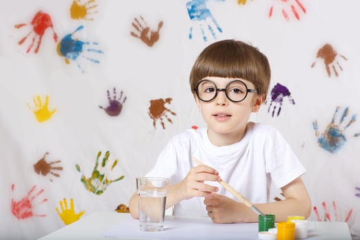 Boy is painting something. photo