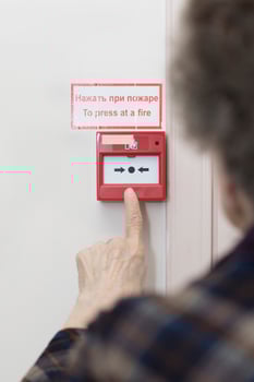 Senior woman wants to press an emergency button photo