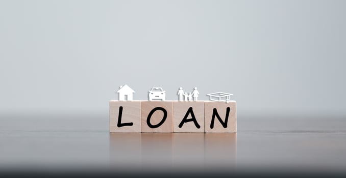 Car, house, personal money loan concept. finance business icon on wooden cube. saving money for a car. money and House. Wooden cubes with word loan. Copy space for text. Loan payment car and house. photo