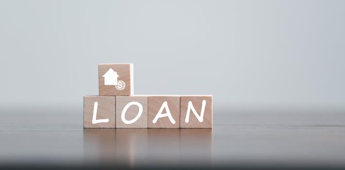 Car, house, personal money loan concept. finance business icon on wooden cube. saving money for a car. money and House. Wooden cubes with word loan. Copy space for text. Loan payment car and house. photo