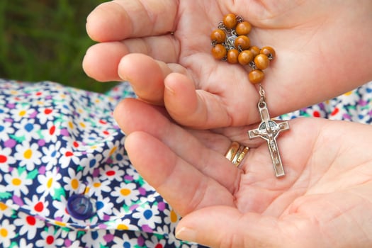 Hands with Rosary beads photo