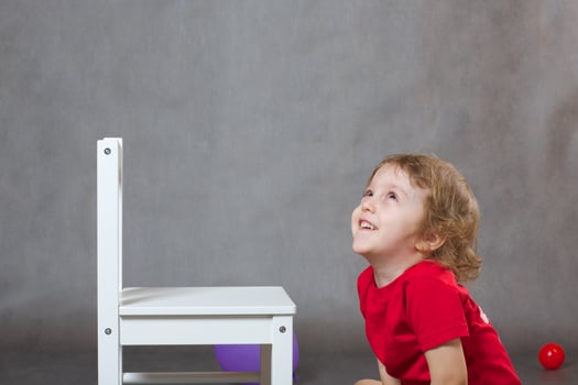 A joyful small child of three years photo
