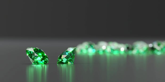 Green Emerald Diamond Group on Glossy Background Soft Focus 3d illustration photo