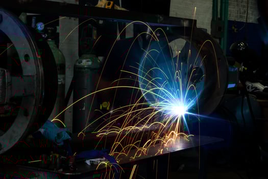 Welding sparks in the dark photo