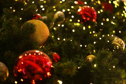 close up decoration ball and light bulb on christmas tree at night photo