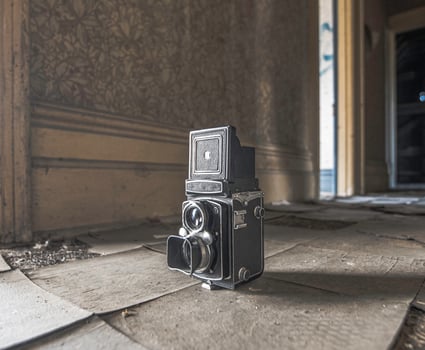 Vintage film camera in abandoned house photo