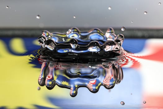 Water droplet drop splash collision dripping pillar Malaysia Flag reflection refraction independence country patriot photo