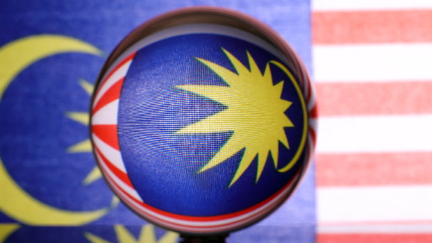 Malaysian flag refraction through glass crystal ball country independence patriot concept photo