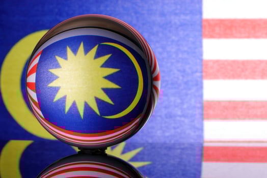 Malaysian flag refraction through glass crystal ball country independence patriot concept photo