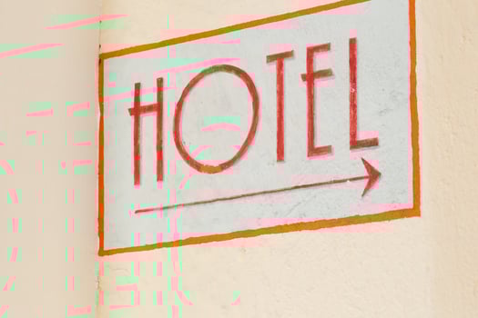 Hotel indicator at the wall in the city photo