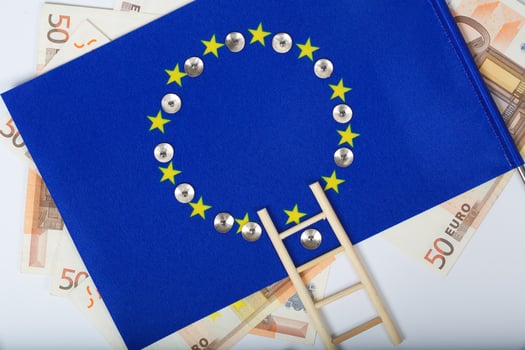 Ladder and pins on an European flag. Closeup photo