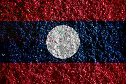 Lao People's Democratic Republic flag on a textured background. Concept collage. photo