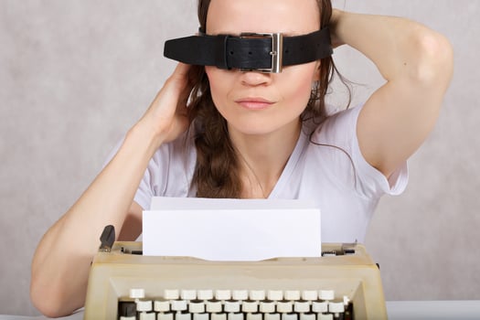 Young lady  with typing machine. Closeup photo